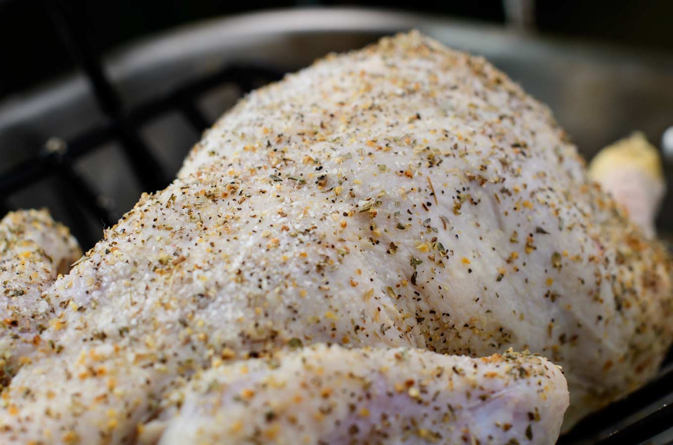 Chicken with Greek seasoning before going in the oven.