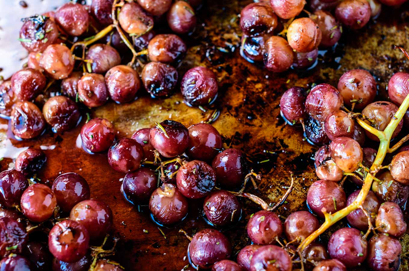 Roasted grapes on a baking sheet