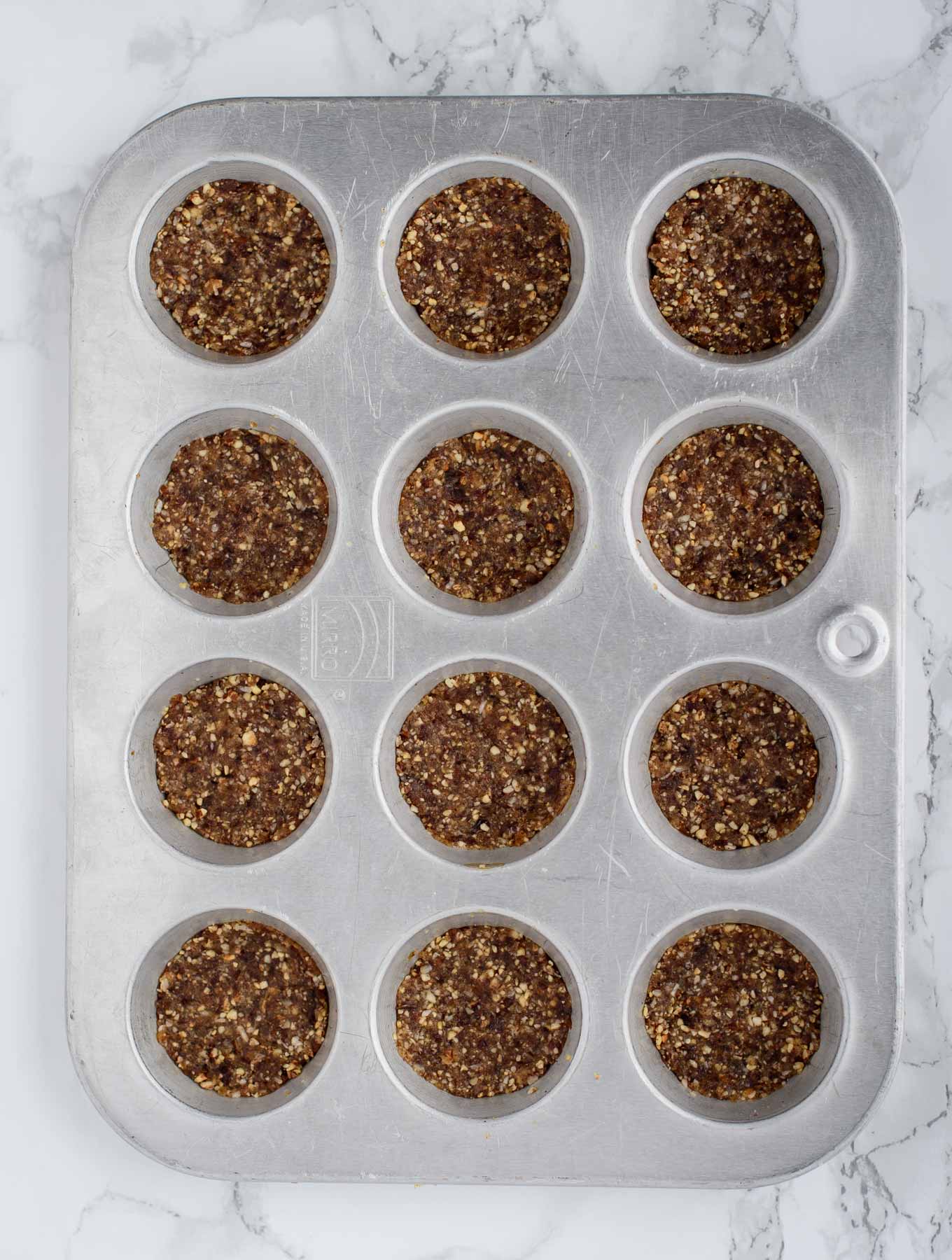 Candied ginger crust in muffin tin