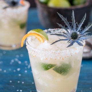 Brazilian margarita with citrus salt on a blue board