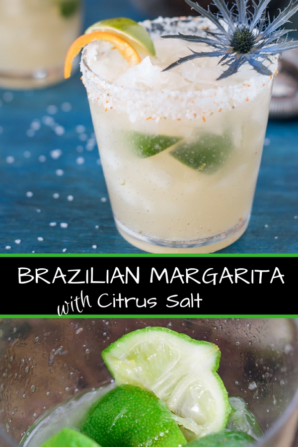 Brazilian margarita with citrus salt on a blue board with limes