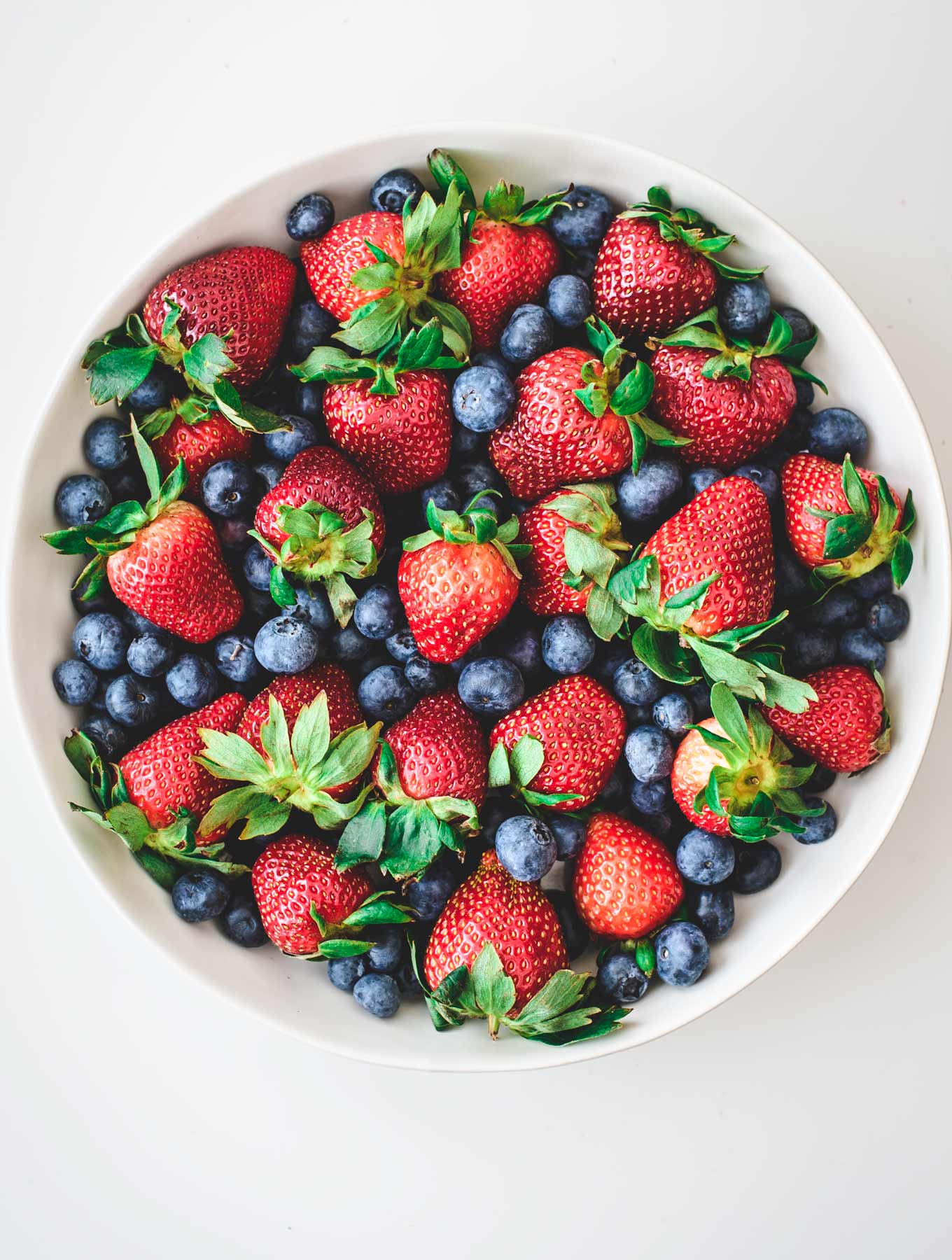 Bowl of fresh strawberries and blueberries