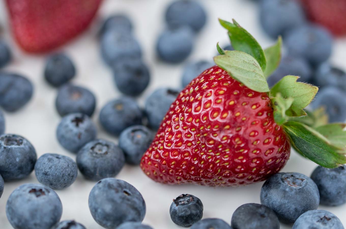 close up of strawberry and blueberries