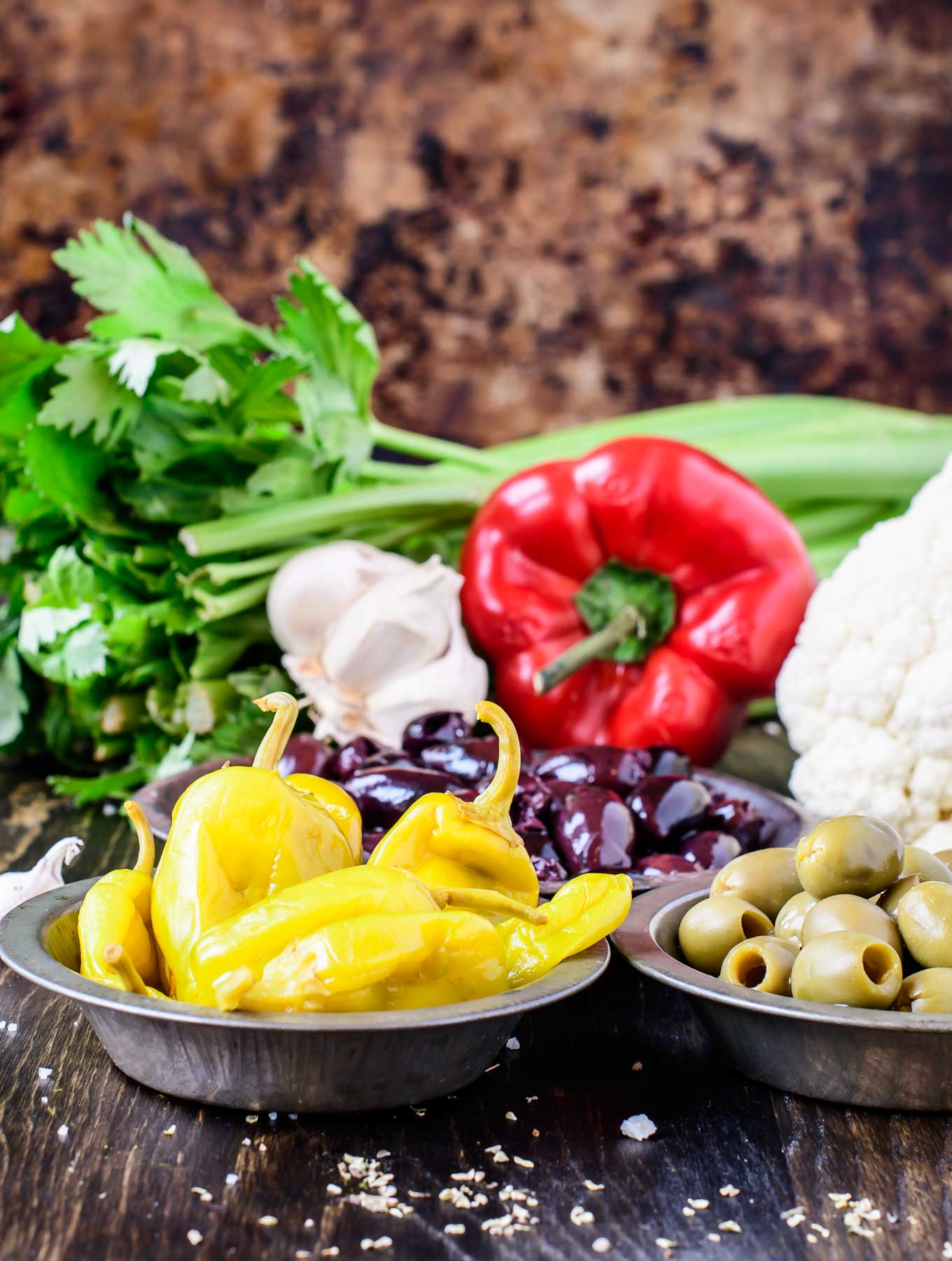 Olive salsa ingredients on wood board