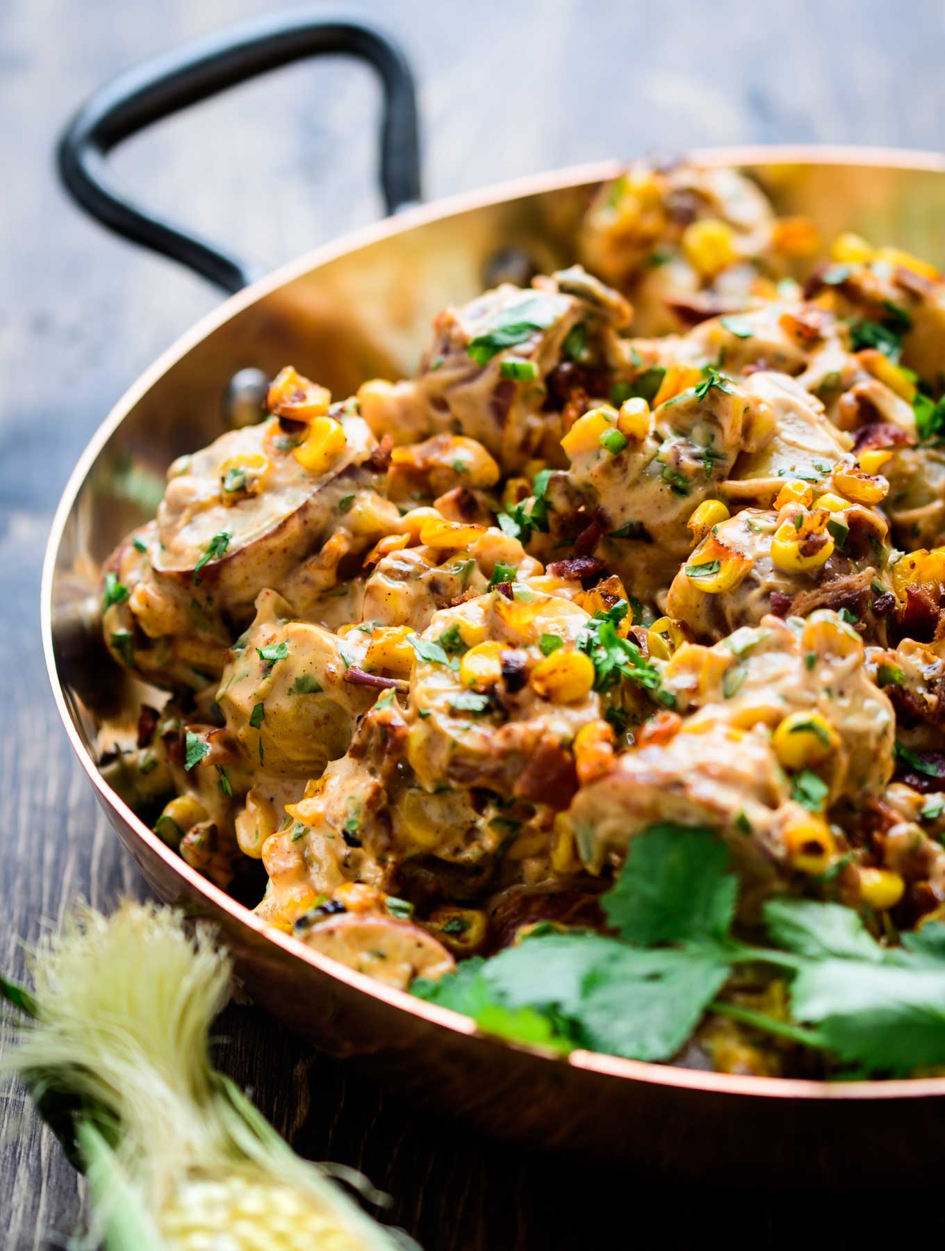 Copper bowl of smoky chipotle potato salad