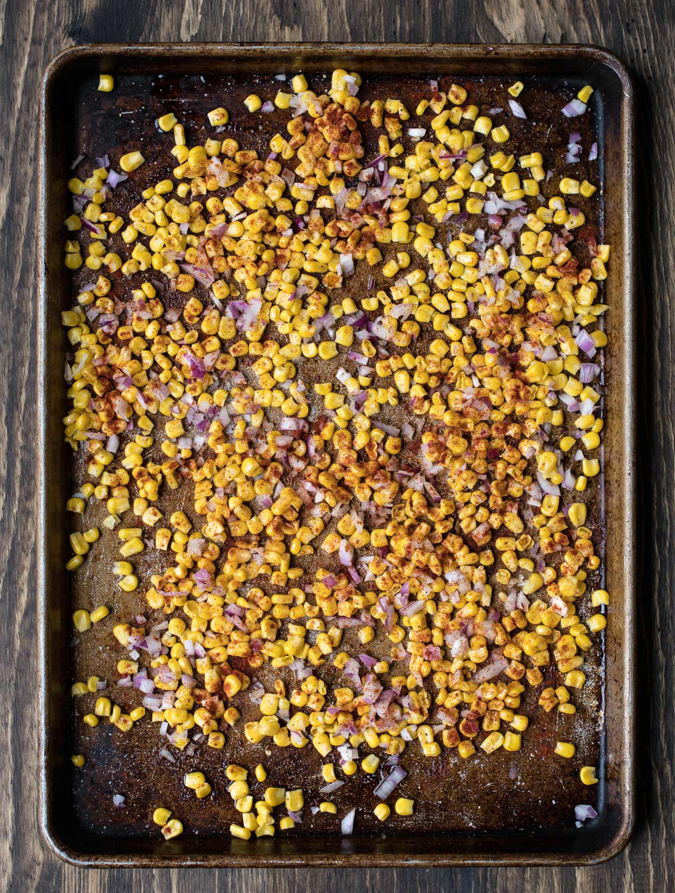 Sheet pan of corn, onions and smoked paprika