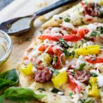 Close up of mediterranean flatbread pizza