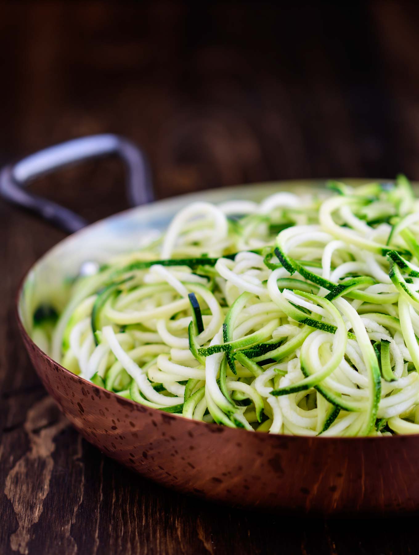 Raw Zucchini in a copper pan