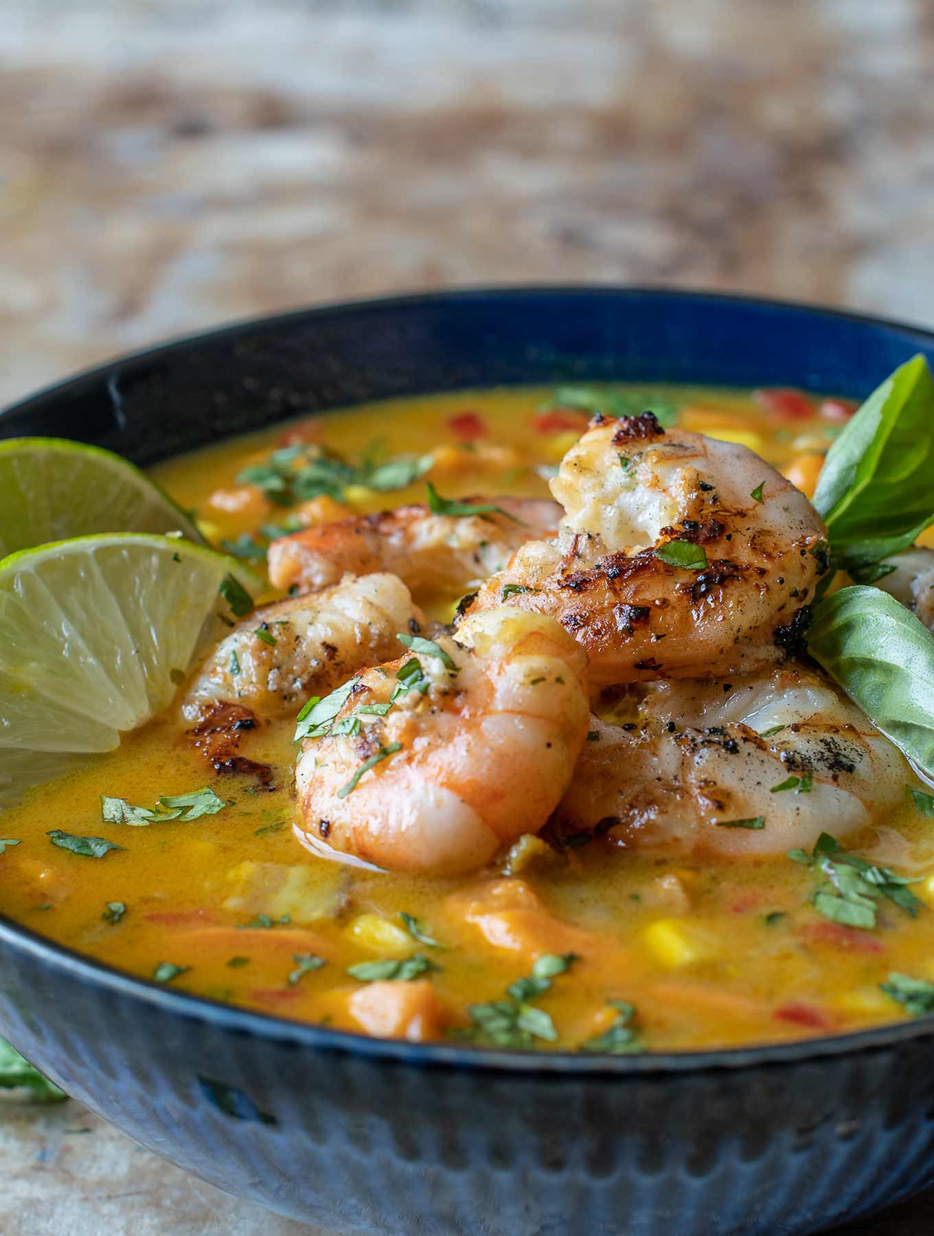 Bowl of corn chowder with shrimp on top