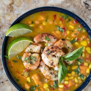 Bowl of corn chowder with shrimp on top