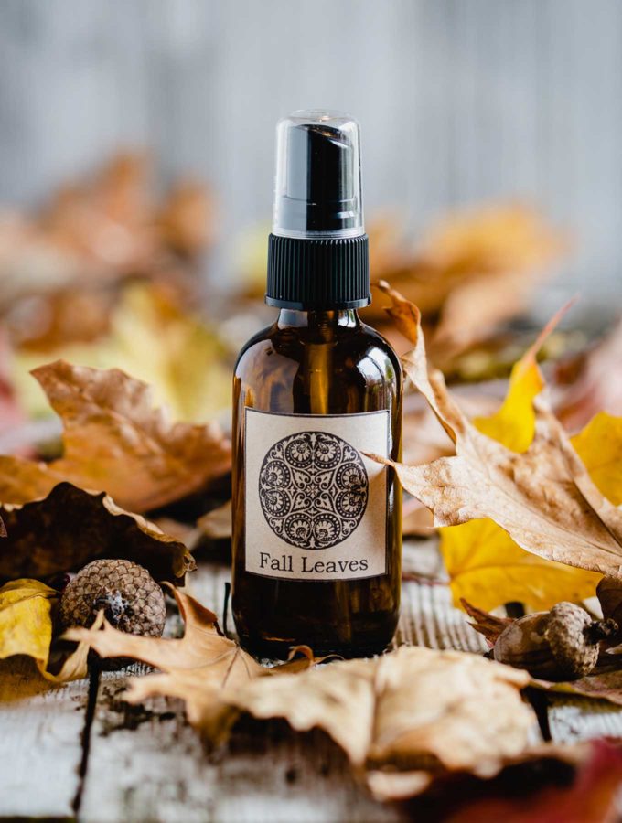 Bottle of fall room spray with leaves