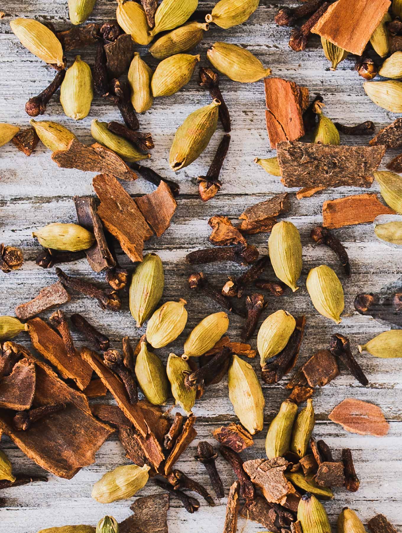 Warm spices on a wooden background