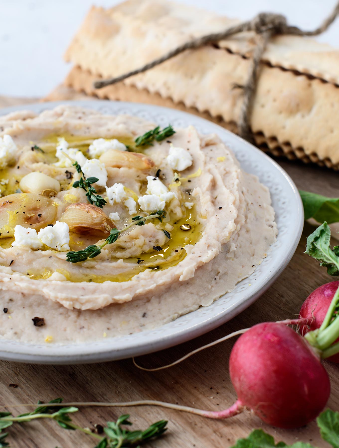 Bowl of roasted garlic bean dip