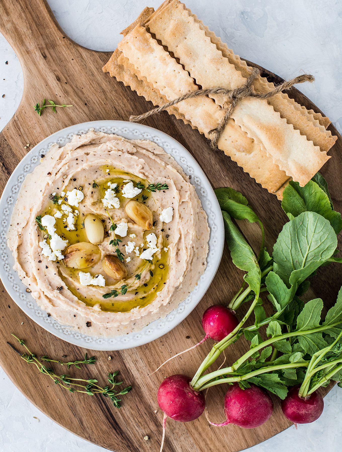 Bowl of roasted garlic bean dip