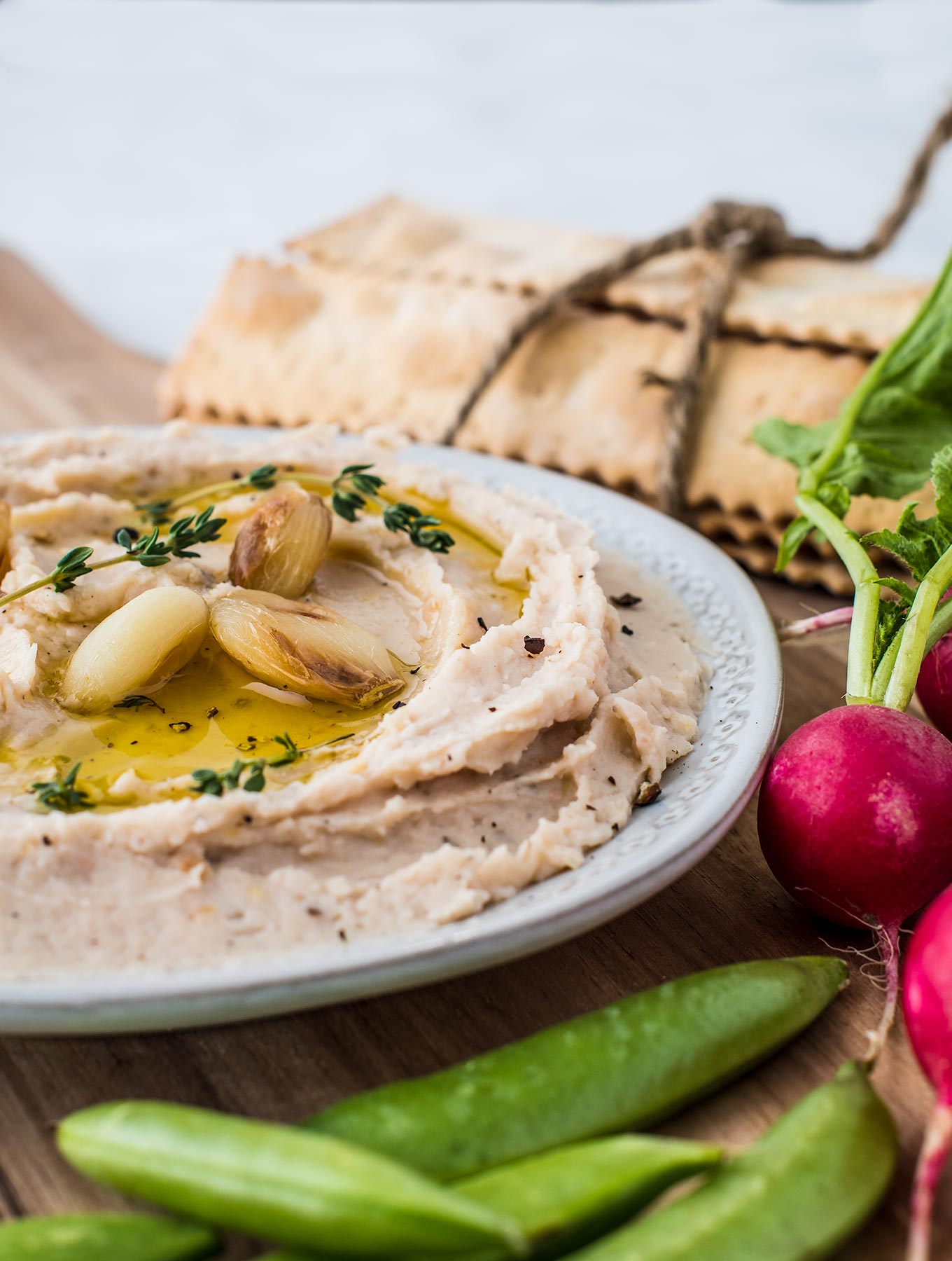 Bowl of roasted garlic bean dip