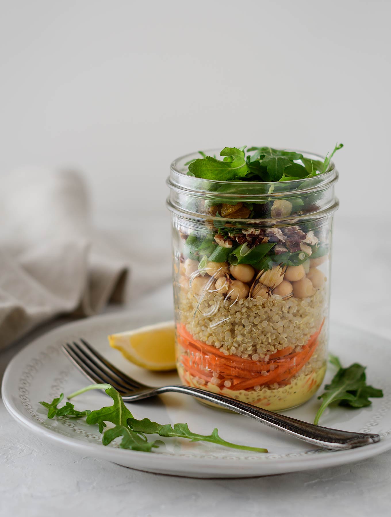 Jar of Moroccan quinoa salad with curry dressing