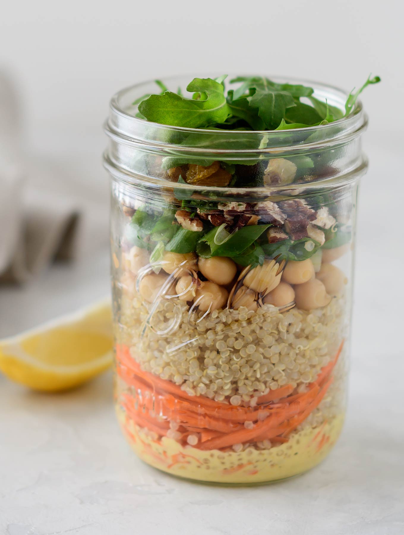 Jar of Moroccan quinoa salad with curry dressing