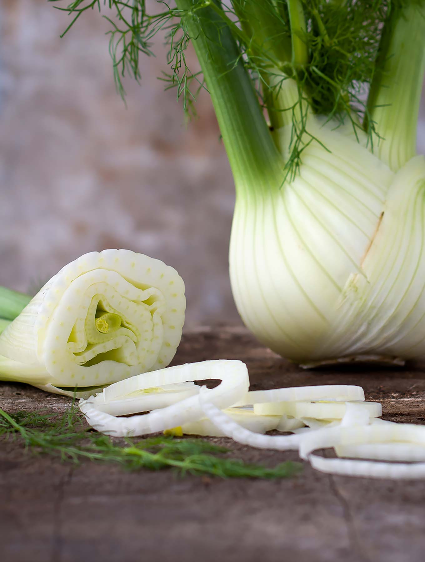 Cut up fennel on a wooden surface