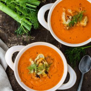 Two bowls of creamy tomato fennel soup