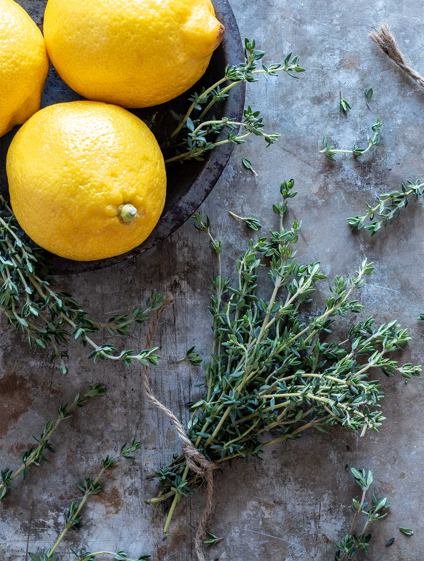 bowl of lemons with thyme