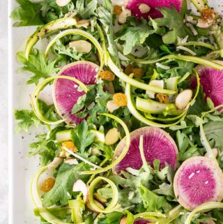 Plate of shaved asparagus salad and watermelon radish