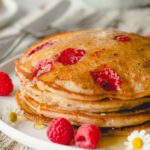 Close up stack of raspberry lemon pancakes