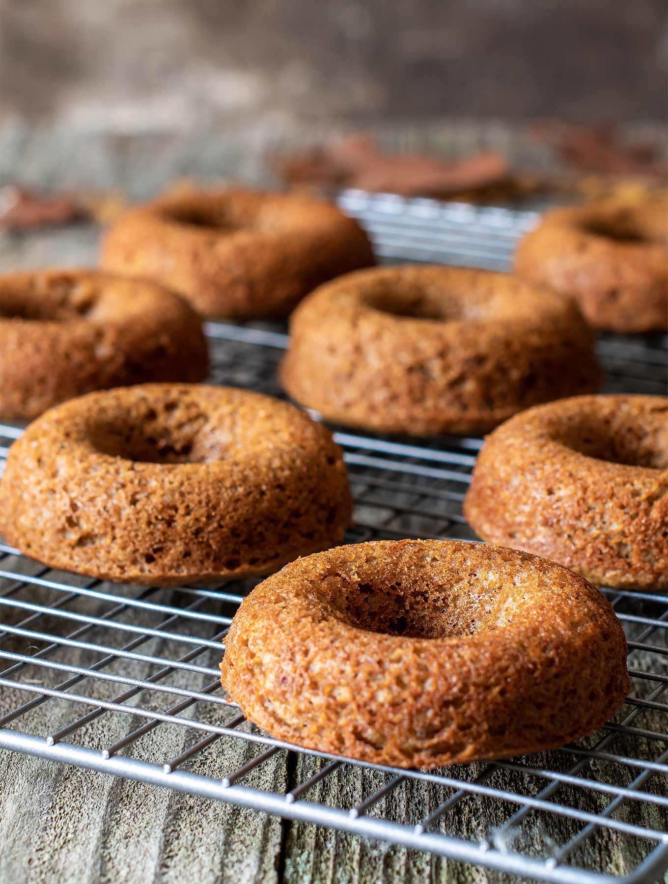 cardamom donuts on a cooling rack